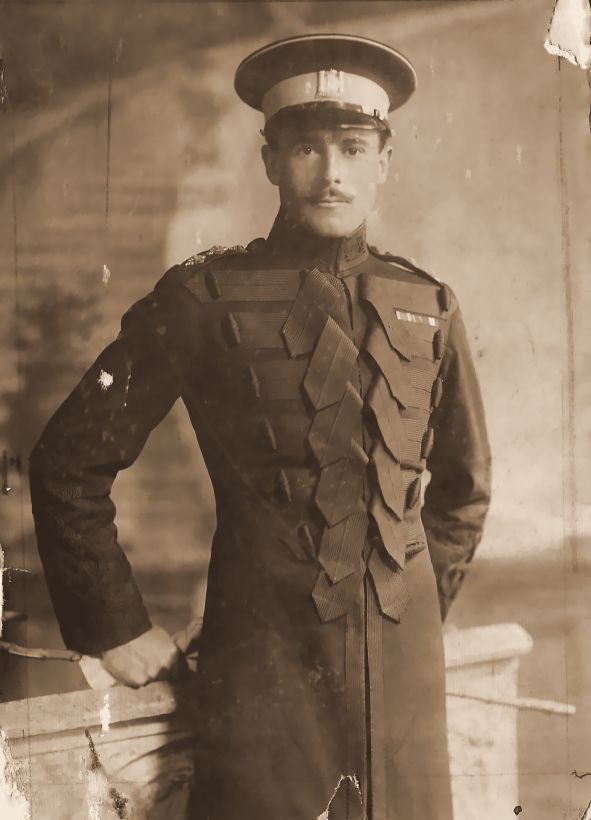 An officer in a braided cavalry coat, wearing medal ribbons. Not yet identified.