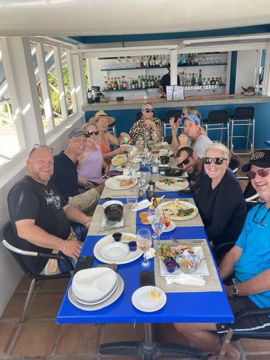 Anguilla friends at Trattoria, November 2023: Darren, John, Alicia, Nathalie, Chloe, Bonnie, Ira, Theron, and Carrie and Jerry, who took over Trattoria in 2025 as Karaya. Darren and Alicia ran Sandbar in Sandy Ground, and it was Darren who recommended Jomal to me.