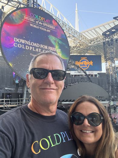Six days after Trattoria’s last day, and newly retired: Chantal and me at Coldplay at Hard Rock Stadium in Miami, July 2025. We went with our friends Dianne and Matthias Kammerer, with Jim Evans’s help.