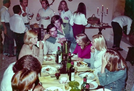 My father at one of the weekend parties at Umberto Caproni’s house in Venegono, being mock-strangled by the model George Rosenberg.