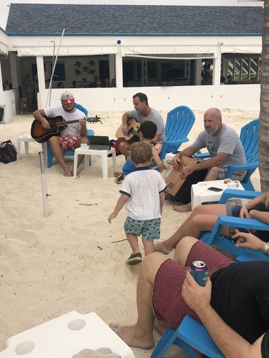 Ira and Marco playing guitar at a party at Trattoria, June 2020. With the island closed and no cases, Anguilla had no lockdown.