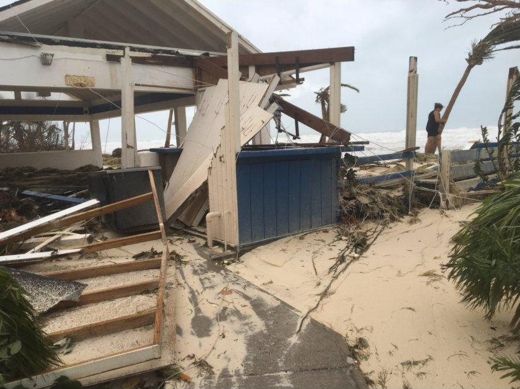 After Irma, September 2017: the dining room with its roof torn open and the beach come inside.