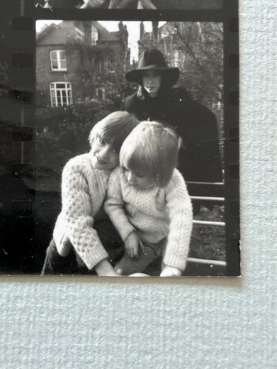 My mother with Robin and me, during her black period, London.