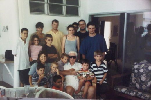 Grandpa Rupert with a houseful of grandchildren and great-grandchildren.